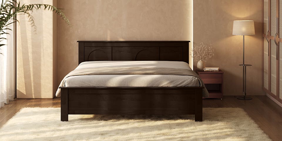 Contemporary bedroom featuring a solid wooden bed with a bedside table and ambient lighting.
