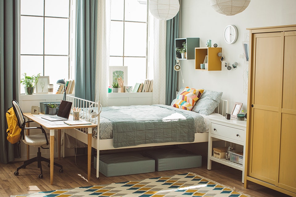 A small bedroom well-designed functionally and aesthetically.