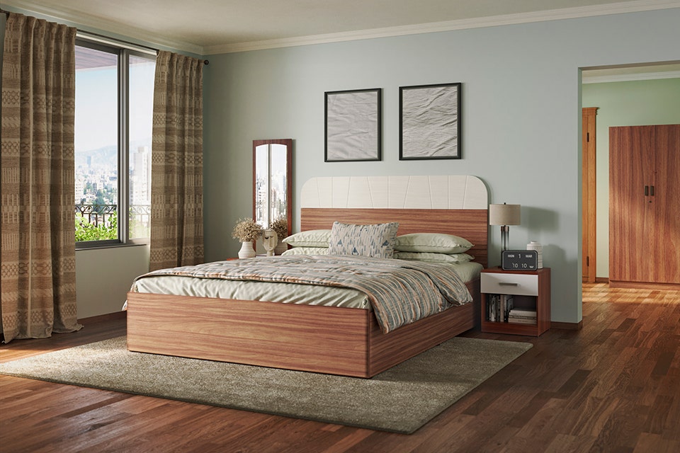 A bedroom with a bed and a door.