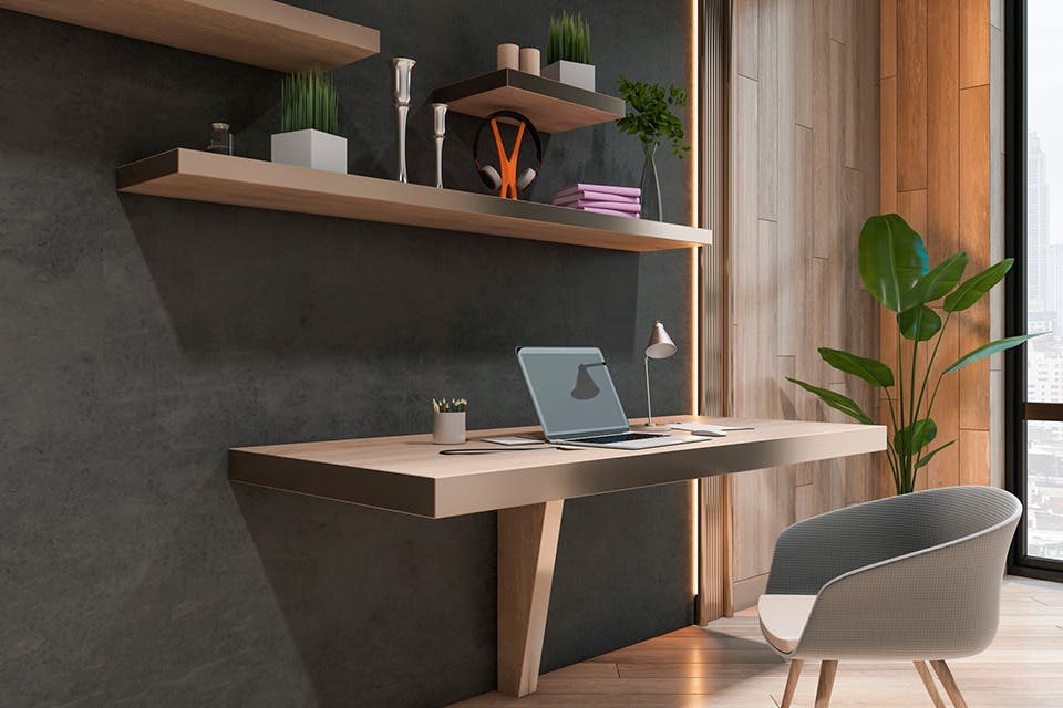 A wall-mounted study table with shelving in a contemporary apartment. 
