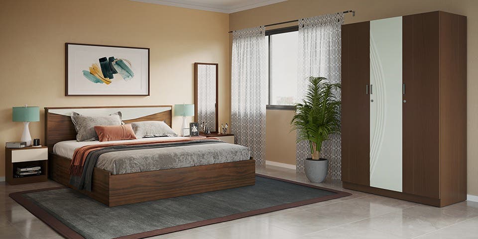 A traditional bedroom set comprising a bed and two bedside tables in a spacious bedroom.