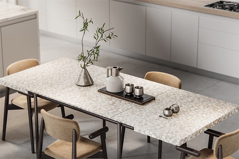 Expandable dining table extended for a family gathering.