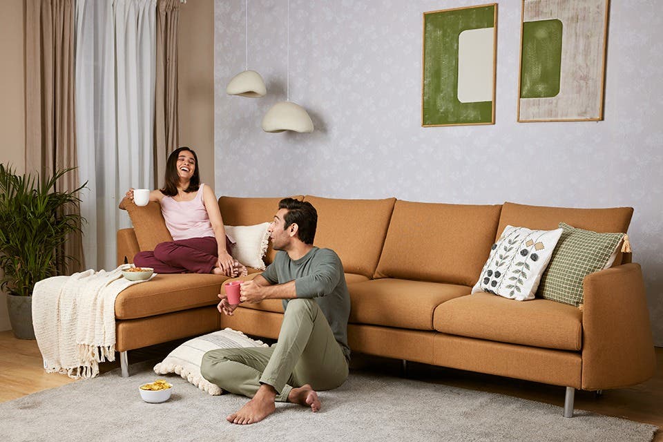 Modern sofa in a contemporary living room shared by a young couple.
