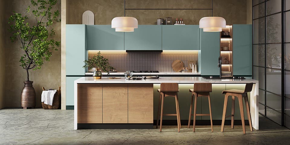 Modern modular kitchen featuring a large central island, integrated seating, built-in appliances and open workspace.