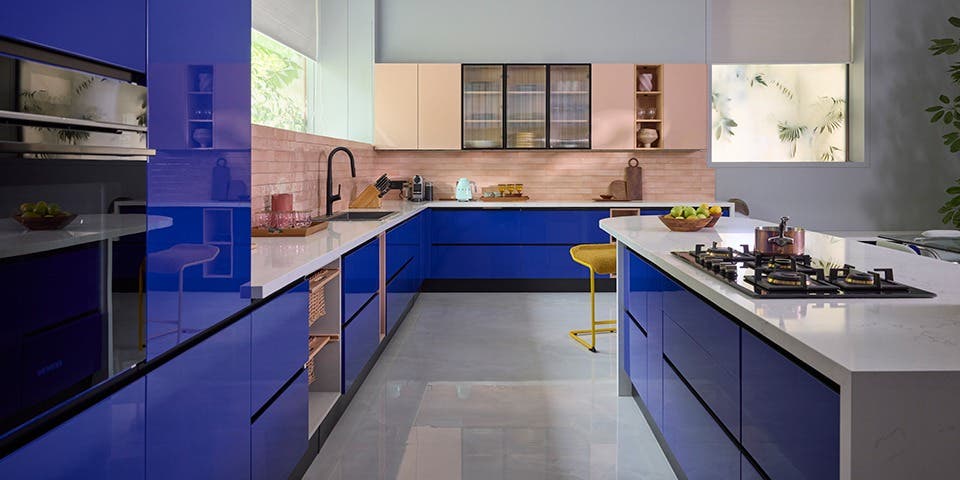 Contemporary modular kitchen with ergonomic work zones, pull-out drawers and organised storage.