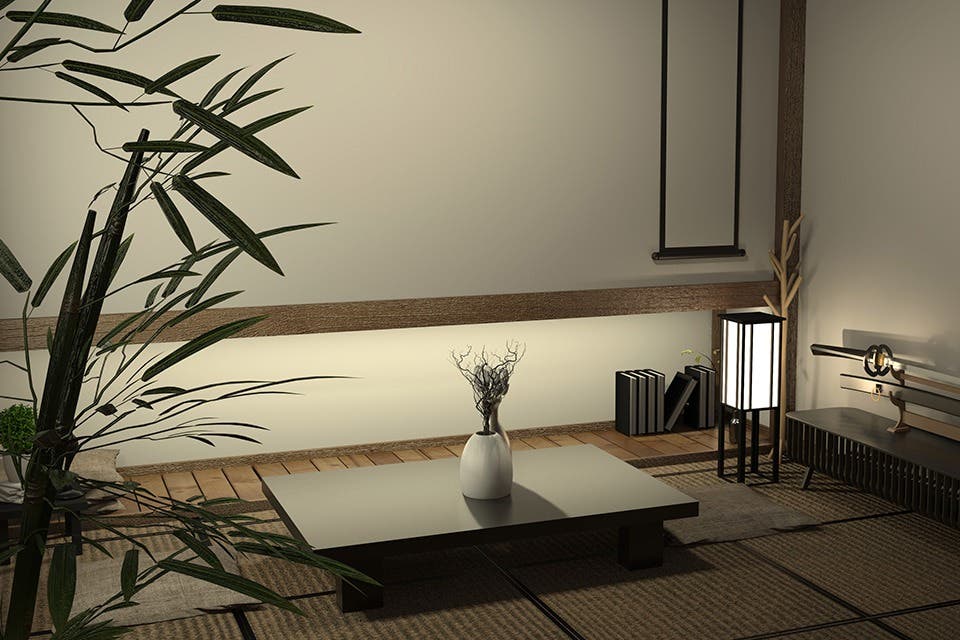 Minimalist Japandi living room illuminated with soft pendant and floor lighting.