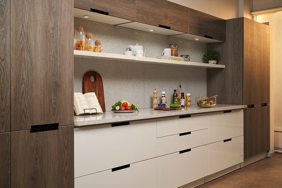 Contemporary modular kitchen with a clutter-free worktop, open shelving, deep drawers and integrated storage for everyday kitchen essentials.