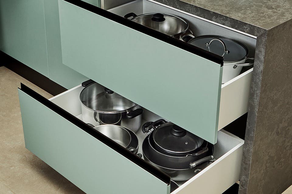 Modular kitchen with organised drawers and purpose-designed storage for cookware.