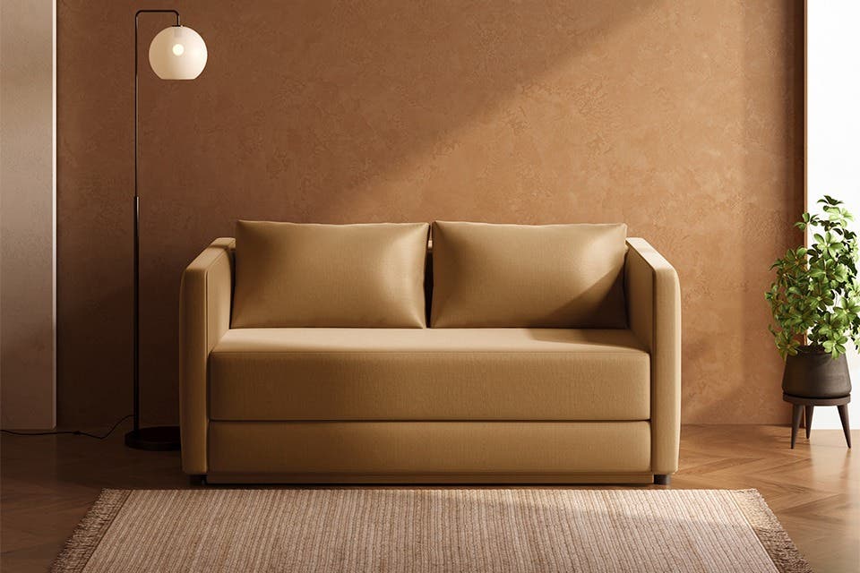 Contemporary Cubed sofa bed from Interio placed in a modern living room.