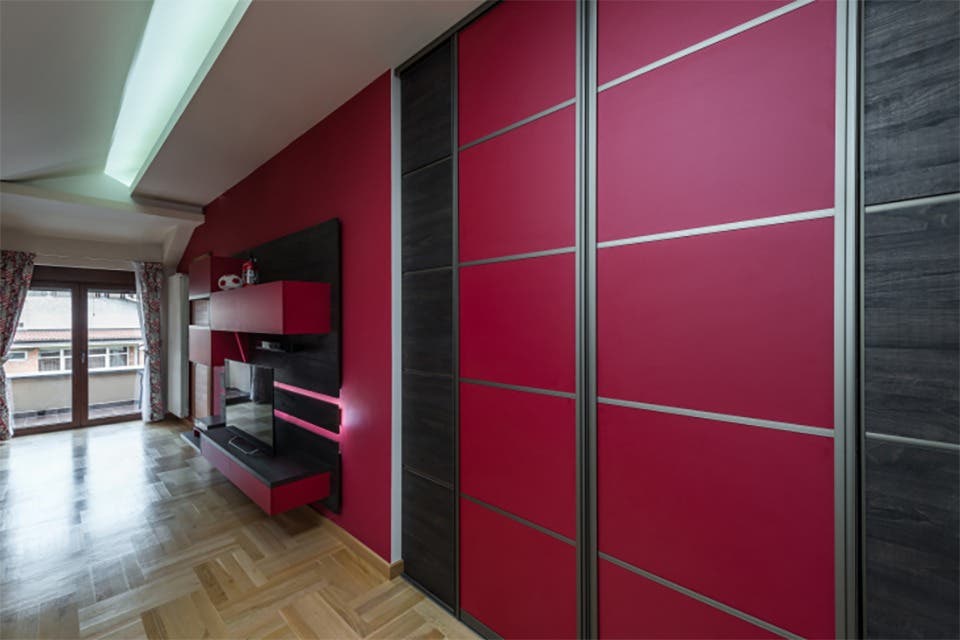 Sliding wardrobe in a modern bedroom showroom. 