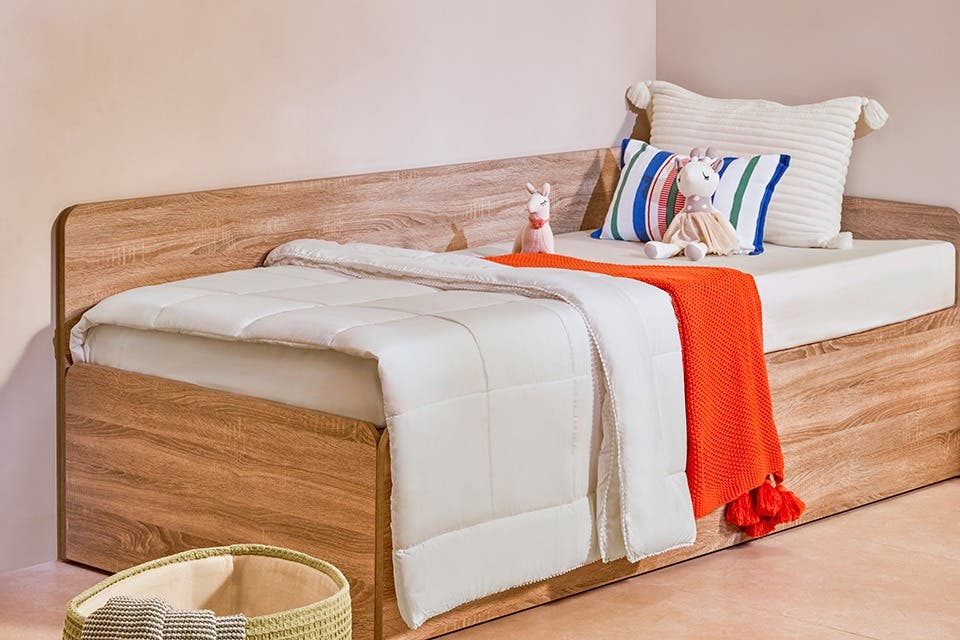 Children’s bedroom featuring eco-friendly wooden furniture and natural materials.