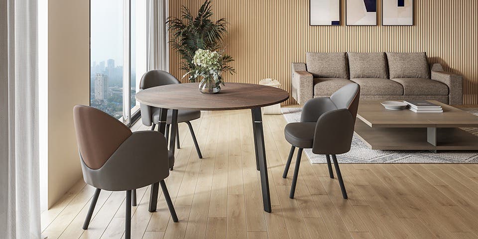 A round dining table with supportive chairs from Interio.