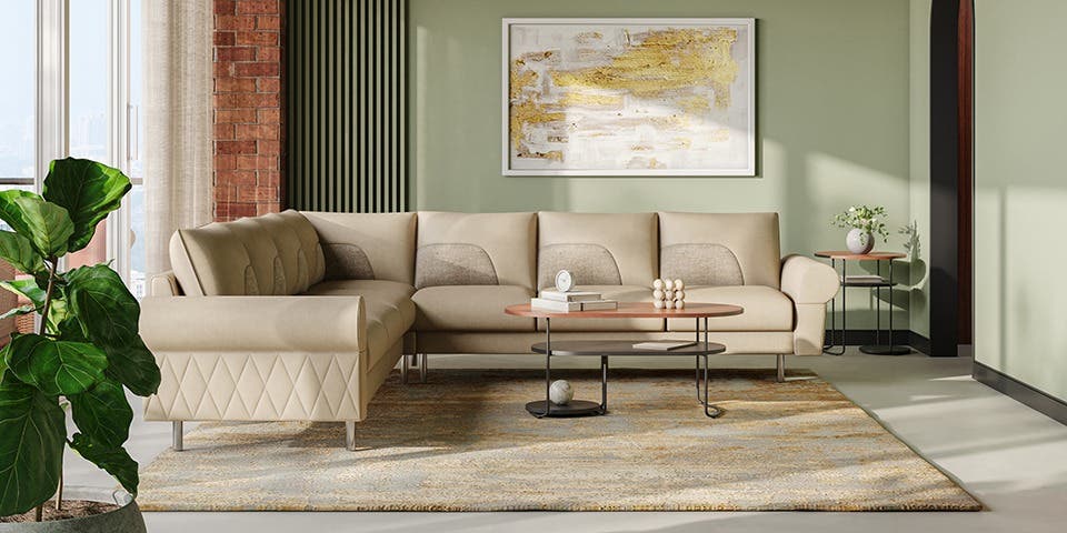  Light dual-tone sofa alongside a coffee table and indoor plants in a spacious contemporary room.